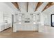 Well-lit kitchen showcasing large island, hardwood floors, and modern white cabinetry at 509 Seven Farms Dr, Charleston, SC 29492