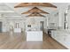 Open kitchen featuring large island, wood beams, and stainless steel appliances at 509 Seven Farms Dr, Charleston, SC 29492