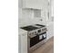 New stainless steel range with white countertops and modern cabinets in kitchen at 509 Seven Farms Dr, Charleston, SC 29492