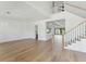 Bright living room featuring hardwood floors, staircase, and open layout at 509 Seven Farms Dr, Charleston, SC 29492