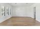 Empty living room with hardwood floors and bright natural light, ready for personalization at 509 Seven Farms Dr, Charleston, SC 29492