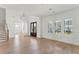 Bright, spacious living room with hardwood floors, plantation shutters, and plenty of natural light at 509 Seven Farms Dr, Charleston, SC 29492