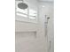 Modern tile shower with rain showerhead and wall niche at 509 Seven Farms Dr, Charleston, SC 29492
