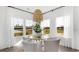 Bright dining area with modern chandelier, view of outside, and a round dining table at 542 Richfield Way, Summerville, SC 29486