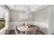 Elegant dining room with a decorative chandelier, round table, and soft neutral tones at 542 Richfield Way, Summerville, SC 29486