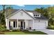 Charming new construction home featuring board and batten siding, inviting front porch, and a two-car garage at 542 Richfield Way, Summerville, SC 29486