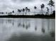 Quiet lake landscape under a cloudy sky with trees mirrored in the water at 542 Richfield Way, Summerville, SC 29486
