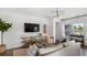 Relaxing living room with modern furniture, large TV, and an entertainment console at 542 Richfield Way, Summerville, SC 29486