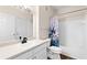 Well-lit bathroom features a vanity with ample storage, white tiled shower, and stylish fixtures at 60 Fenwick Hall Allee # 521, Johns Island, SC 29455