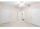 Spacious bedroom featuring neutral carpeting and a ceiling fan; the room also has two closets for storage at 60 Fenwick Hall Allee # 521, Johns Island, SC 29455