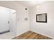 Entryway with tile and wood floors, decorative mirror, and a pendant light fixture at 60 Fenwick Hall Allee # 521, Johns Island, SC 29455