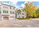 Attractive townhome exterior with well-maintained landscaping and convenient garage parking at 60 Fenwick Hall Allee # 521, Johns Island, SC 29455