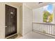 Front door and porch of unit 521 with calming paint and a place to sit and relax at 60 Fenwick Hall Allee # 521, Johns Island, SC 29455