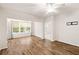 Living room features wood floors, neutral paint, and a bright window for tons of natural light at 60 Fenwick Hall Allee # 521, Johns Island, SC 29455
