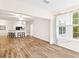 Open living area with wood floors, open floor plan, and light coming from the window at 60 Fenwick Hall Allee # 521, Johns Island, SC 29455