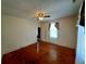 Bright bedroom with hardwood floors, natural light from a window, and a classic ceiling fan at 668 Rutledge Ave, Charleston, SC 29403