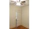 Bedroom featuring a ceiling fan, door, neutral walls, and hardwood floors at 668 Rutledge Ave, Charleston, SC 29403