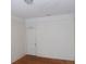 Bedroom features a white door, neutral walls, and hardwood floors at 668 Rutledge Ave, Charleston, SC 29403