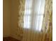 Bedroom featuring floral curtains and a large window providing natural light at 668 Rutledge Ave, Charleston, SC 29403
