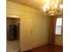 Dining area with a view of the kitchen, hardwood floors, and natural light from window at 668 Rutledge Ave, Charleston, SC 29403