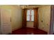 Dining room featuring hardwood floors, chandelier lighting, and a large window with decorative curtains at 668 Rutledge Ave, Charleston, SC 29403