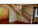 Inviting foyer showcases a staircase, chandelier, and traditional design elements at 668 Rutledge Ave, Charleston, SC 29403