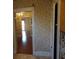 Hallway view towards a dining and living room with hardwood floors and natural light at 668 Rutledge Ave, Charleston, SC 29403