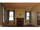 Traditional living room featuring a brick fireplace, hardwood floors, and an elegant chandelier at 668 Rutledge Ave, Charleston, SC 29403