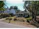 Charming single-story home with a covered porch and a well-maintained front yard at 727 Spark St, Mount Pleasant, SC 29464