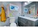 Bathroom featuring a gray vanity with marble countertop and under sink storage at 731 Fort Johnson Rd, Charleston, SC 29412