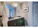 Bathroom with a unique vanity with storage and drawers below a wide mirror at 731 Fort Johnson Rd, Charleston, SC 29412
