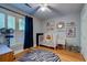 Light-filled bedroom with Zebra rug, white crib, wood floors, and natural light at 731 Fort Johnson Rd, Charleston, SC 29412