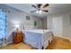 Cozy bedroom with hardwood floors, white metal frame bed and a vintage nightstand at 731 Fort Johnson Rd, Charleston, SC 29412