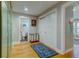 Hallway with wooden floors with laundry hamper, closets and leads to a bathroom at 731 Fort Johnson Rd, Charleston, SC 29412