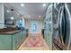 Well-lit kitchen featuring custom cabinets, stainless appliances, and a granite counter at 731 Fort Johnson Rd, Charleston, SC 29412