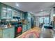 Spacious kitchen with green cabinets, stainless steel appliances, and a breakfast nook at 731 Fort Johnson Rd, Charleston, SC 29412