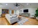 Spacious living room with hardwood floors, neutral colored sectional and decor at 731 Fort Johnson Rd, Charleston, SC 29412