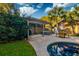 Backyard pool area featuring a pergola, outdoor seating, and mature landscaping at 731 Fort Johnson Rd, Charleston, SC 29412