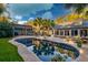 Inviting backyard pool featuring a hot tub, outdoor seating, palm trees, and a charming covered pergola at 731 Fort Johnson Rd, Charleston, SC 29412