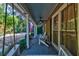 Charming front porch featuring a swing, ceiling fan, and comfortable seating with view at 731 Fort Johnson Rd, Charleston, SC 29412