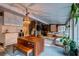 Inviting sunroom with dining and lounge areas, featuring a decorative chandelier and tile floors at 731 Fort Johnson Rd, Charleston, SC 29412