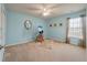 Bright bedroom featuring carpet flooring, large window, and neutral paint at 7753 Kinston St, North Charleston, SC 29418