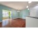 Bright dining area with stylish chandelier and a view into the sunroom at 7753 Kinston St, North Charleston, SC 29418