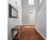 Bright foyer with hardwood floors, high ceilings, and decorative wall art at 7753 Kinston St, North Charleston, SC 29418