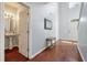 Welcoming foyer with hardwood floors, high ceilings, and convenient half bathroom at 7753 Kinston St, North Charleston, SC 29418