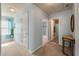 Bright hallway leading to bedrooms and bathroom, with a neutral color scheme at 7753 Kinston St, North Charleston, SC 29418