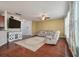 Bright living room with hardwood floors, a ceiling fan, and cozy seating area at 7753 Kinston St, North Charleston, SC 29418