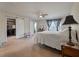 Spacious main bedroom with a ceiling fan, ensuite bathroom and closet at 7753 Kinston St, North Charleston, SC 29418