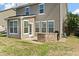 Covered patio featuring a built-in grill and convenient access to the home's interior at 7753 Kinston St, North Charleston, SC 29418
