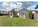 Backyard shed with a garden and a pergola, offering practical storage and gardening space at 7753 Kinston St, North Charleston, SC 29418